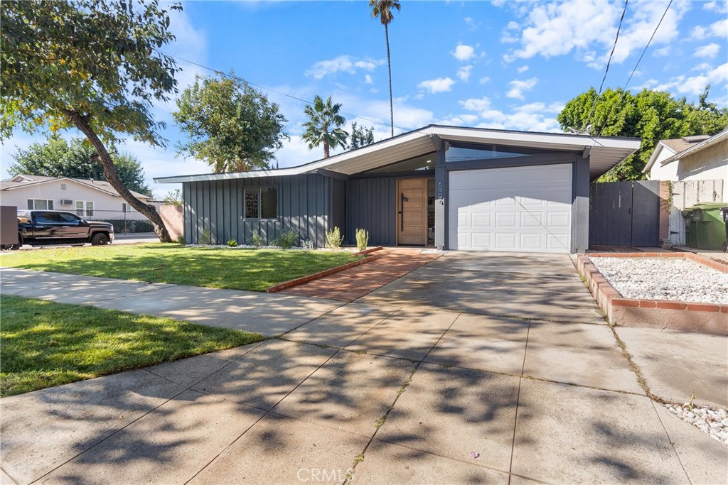 6909 De Celis Place Van Nuys, CA 91406 - Photo 41 of 46 a view of a house with a yard