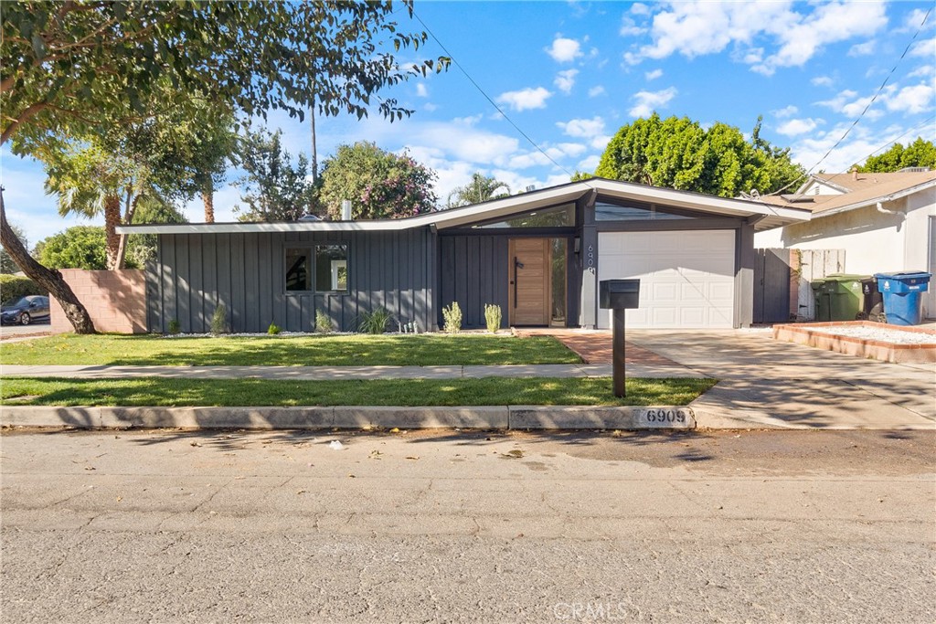 6909 De Celis Place Van Nuys, CA 91406 - Photo 42 of 46 a front view of a house with garden