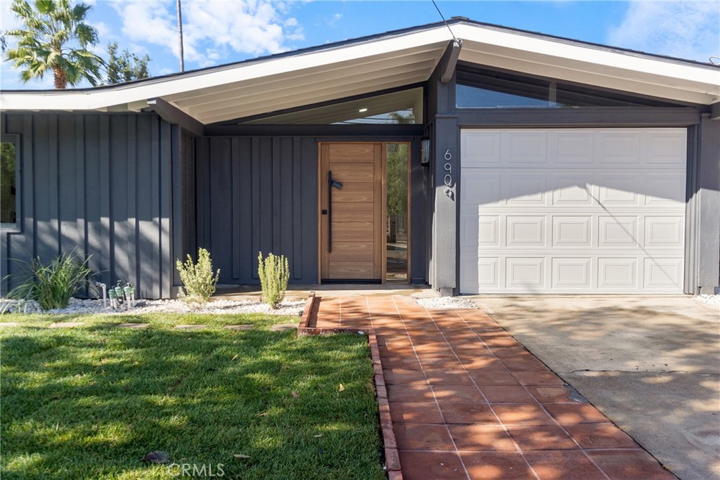 6909 De Celis Place Van Nuys, CA 91406 - Photo 43 of 46 a backyard of a house with garden and patio