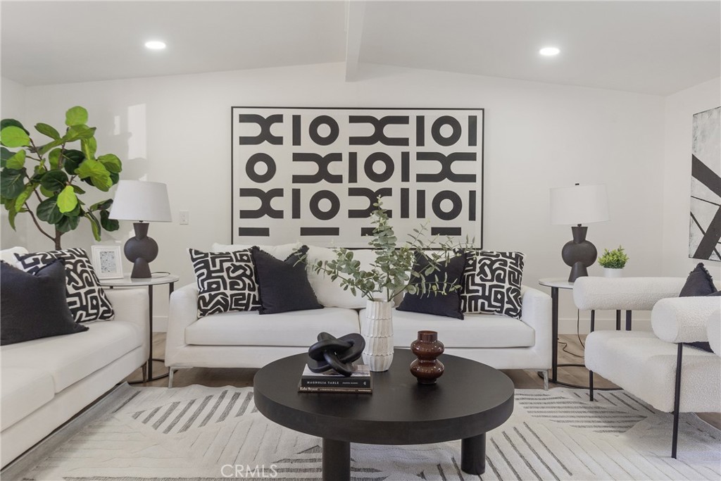 6909 De Celis Place Van Nuys, CA 91406 - Photo 5 of 46 a view of a livingroom with furniture and a couch
