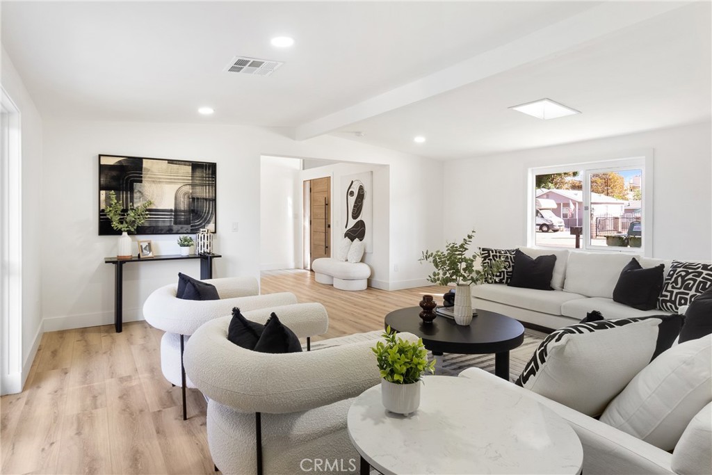 6909 De Celis Place Van Nuys, CA 91406 - Photo 8 of 46 a living room with furniture and a flat screen tv