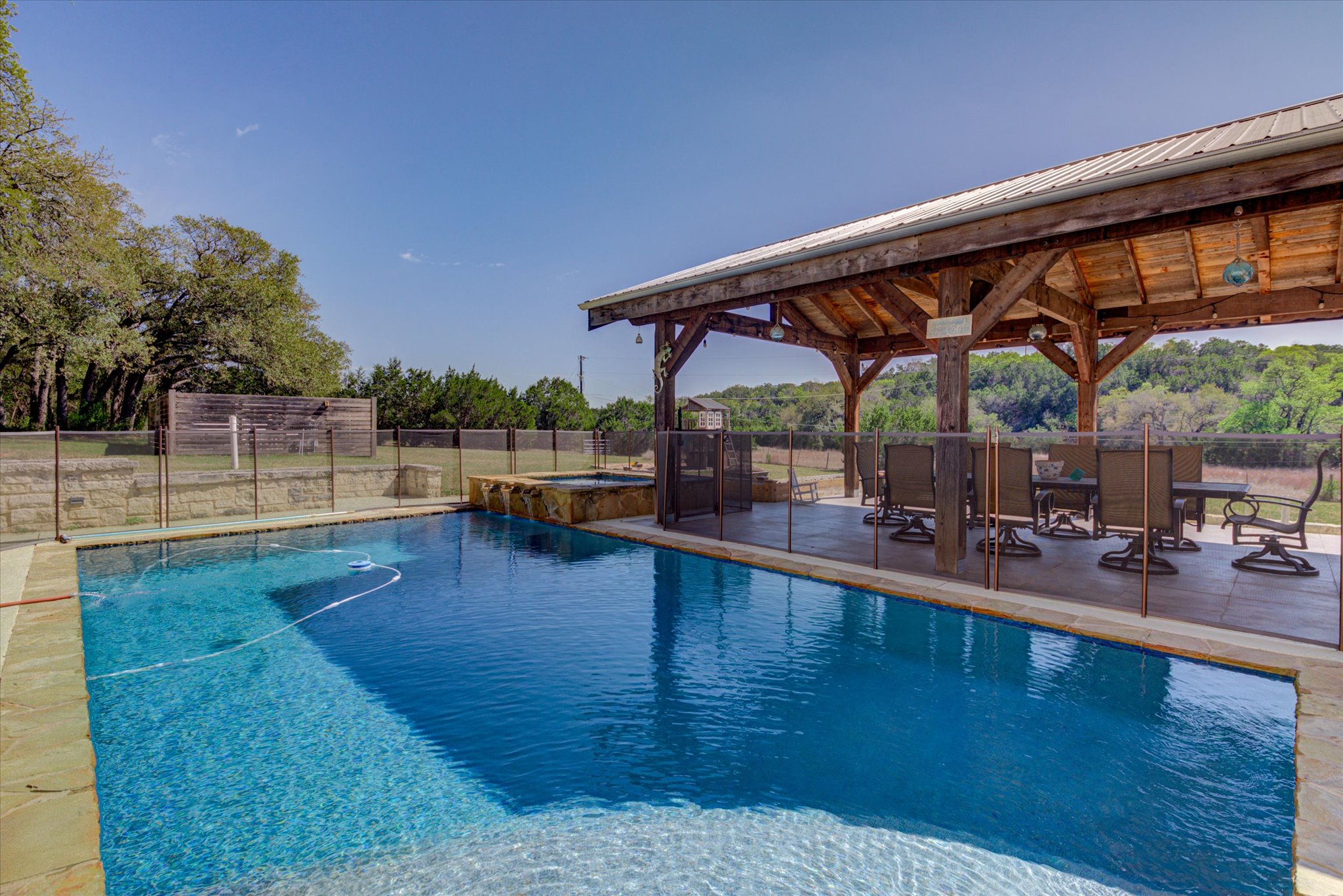 13423 Trail Driver Street Austin, TX 78737 - Photo 2 of 40 Relaxing pool / spa with a fenced backyard and a patio area