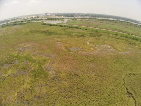 a view of a field with an ocean view