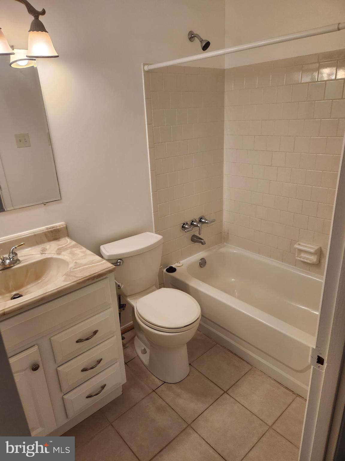 7104 Lasting Light Way Columbia, MD 21045 - Photo 20 of 40 a bathroom with a sink toilet and shower