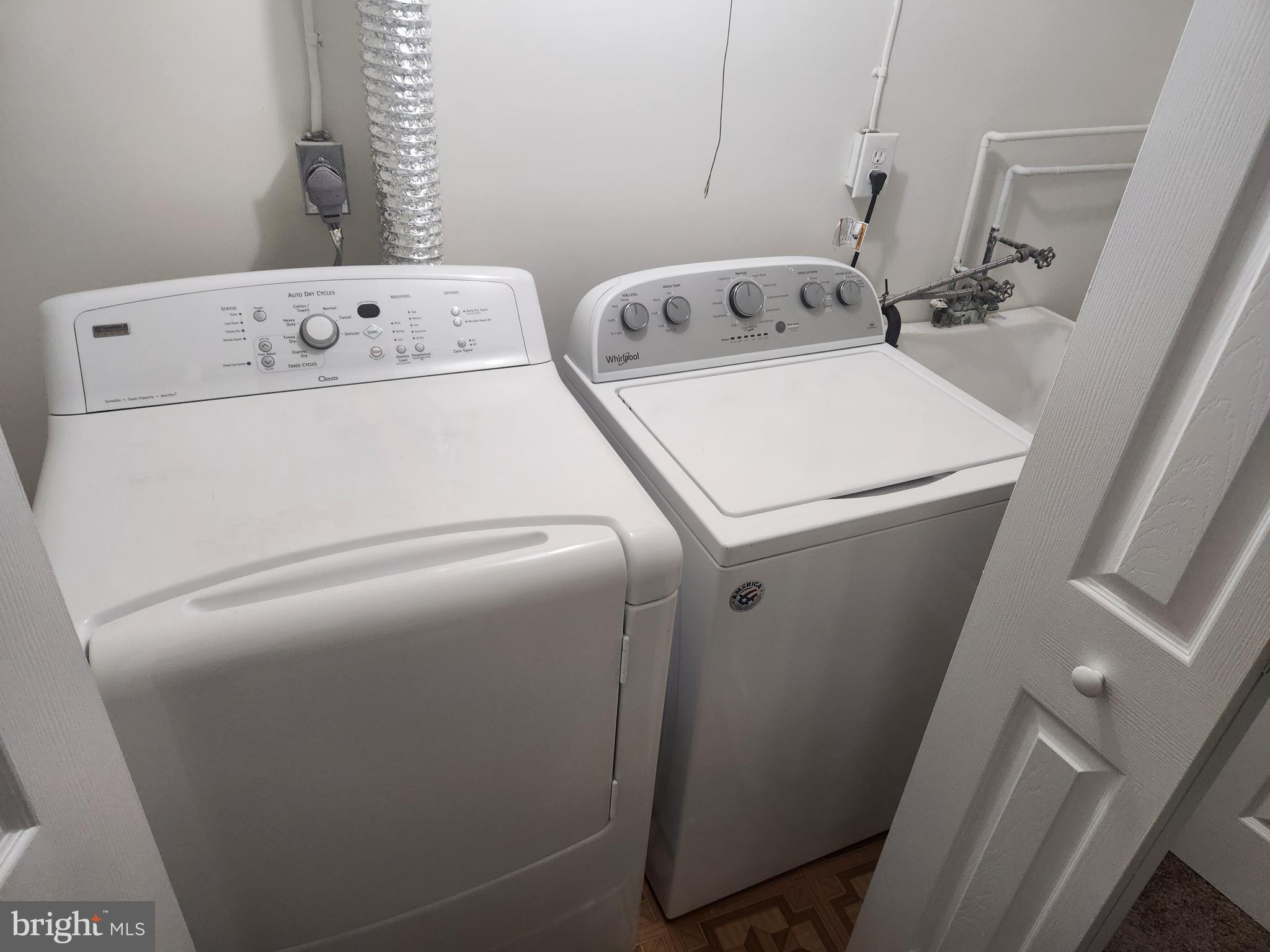 7104 Lasting Light Way Columbia, MD 21045 - Photo 37 of 40 a utility room with dryer and washer