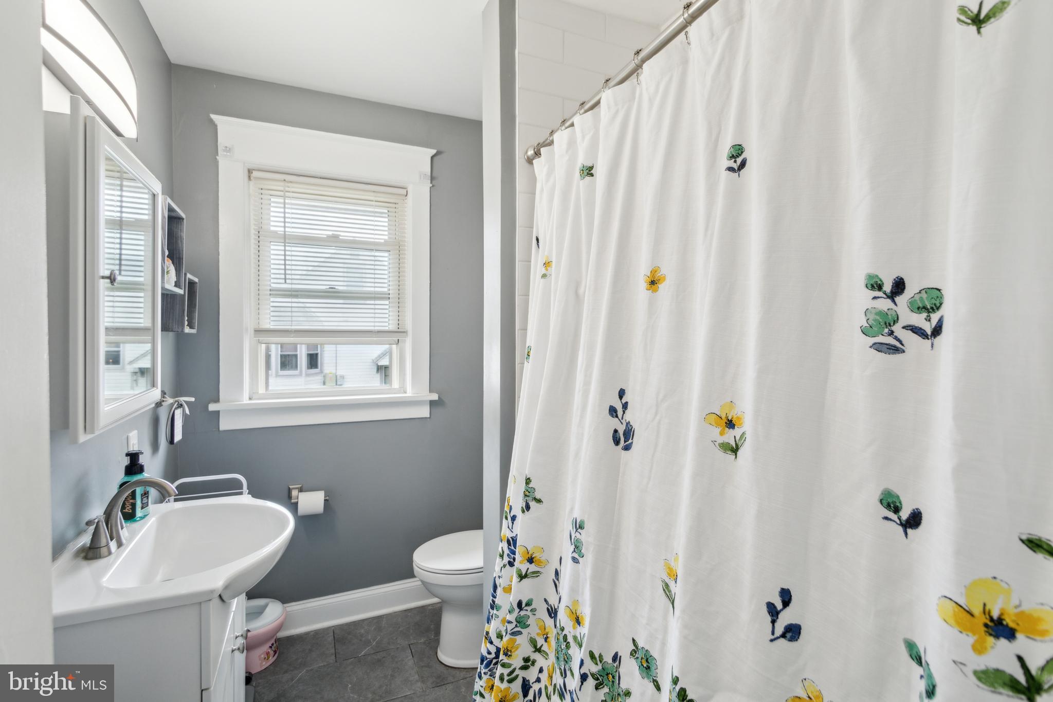 812 Lambert Avenue Mount Ephraim, NJ 08059 - Photo 16 of 24 a bathroom with a sink toilet and shower