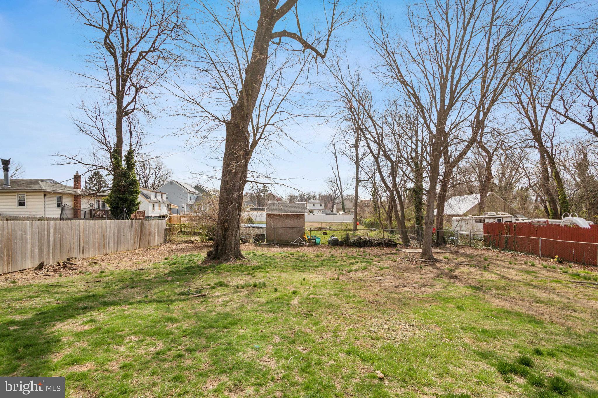 812 Lambert Avenue Mount Ephraim, NJ 08059 - Photo 24 of 24 a view of a yard with a house and a large tree