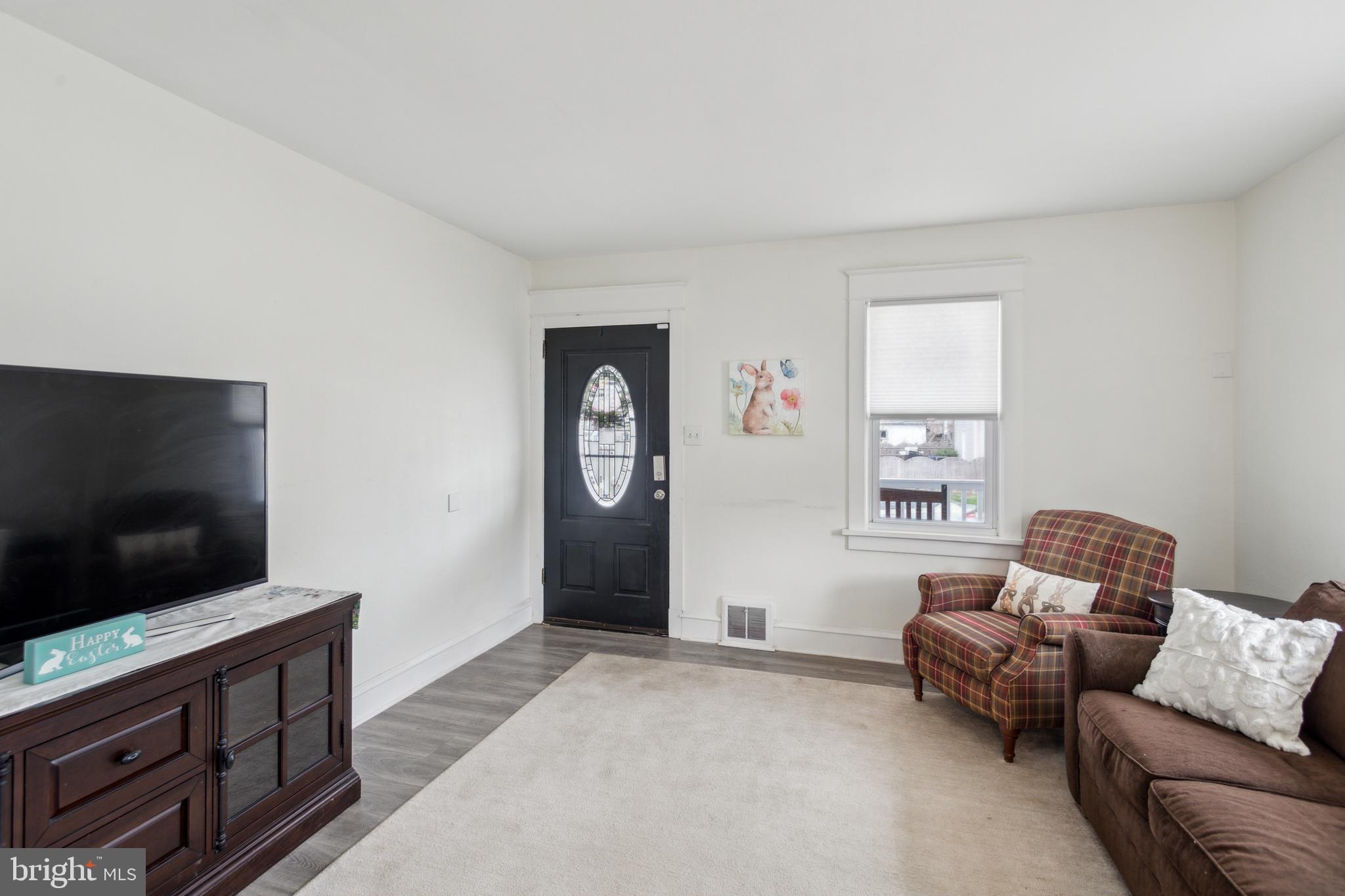 812 Lambert Avenue Mount Ephraim, NJ 08059 - Photo 3 of 24 a living room with furniture and a flat screen tv