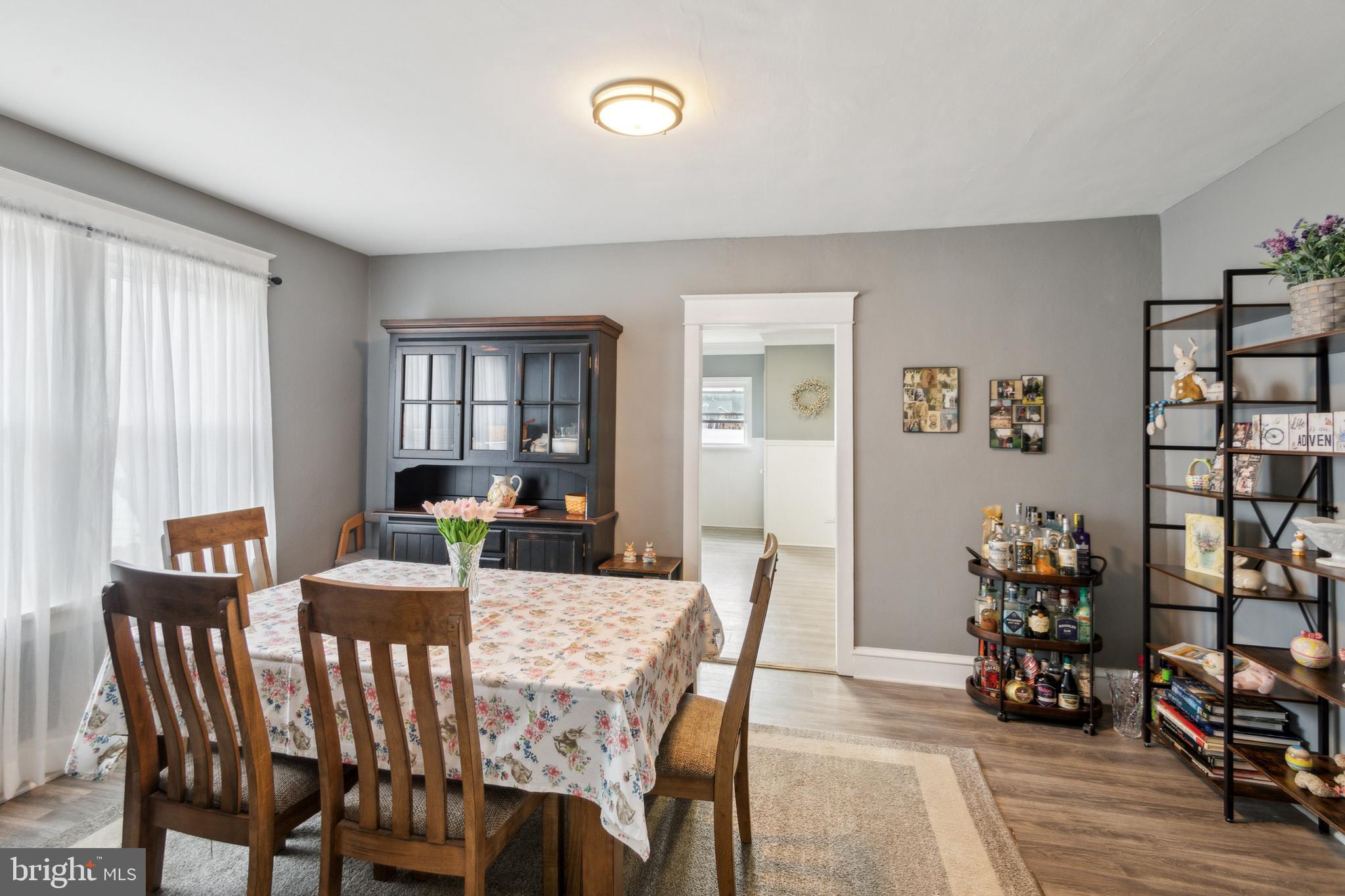 812 Lambert Avenue Mount Ephraim, NJ 08059 - Photo 5 of 24 a view of a dining room with furniture and wooden floor
