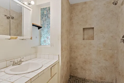 a bathroom with a sink and a mirror