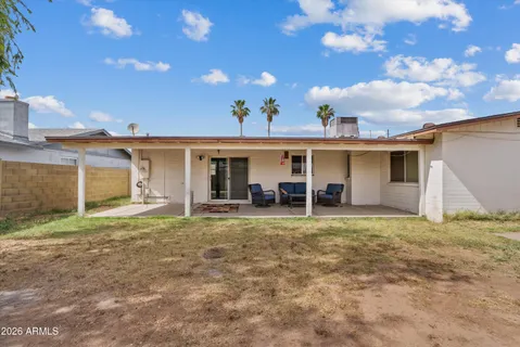 a view of a house with a yard and garage