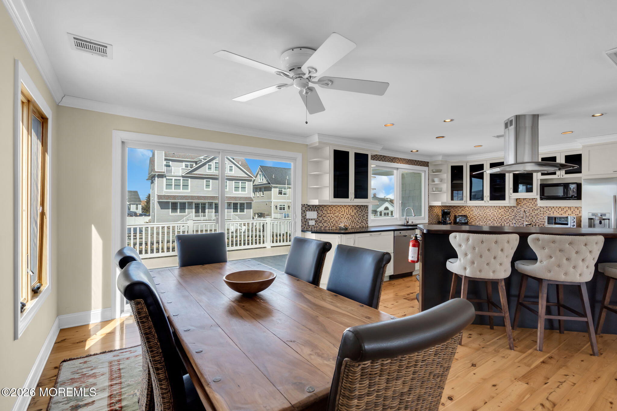 326 Cutter Lane Mantoloking, NJ 08738 - Photo 13 of 35 a living room with furniture dining table and a fireplace