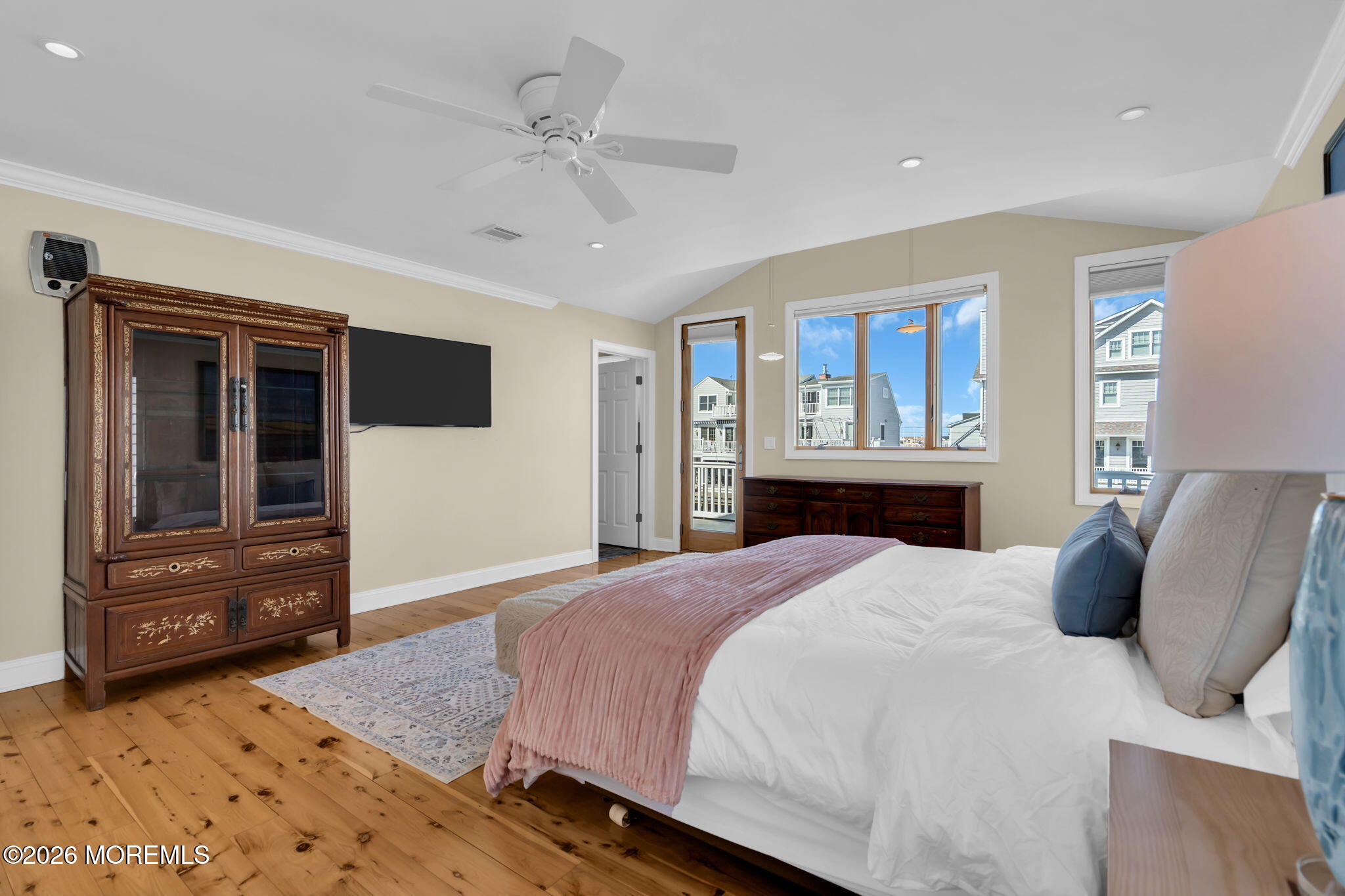 326 Cutter Lane Mantoloking, NJ 08738 - Photo 18 of 35 a bedroom with a large bed and a dresser