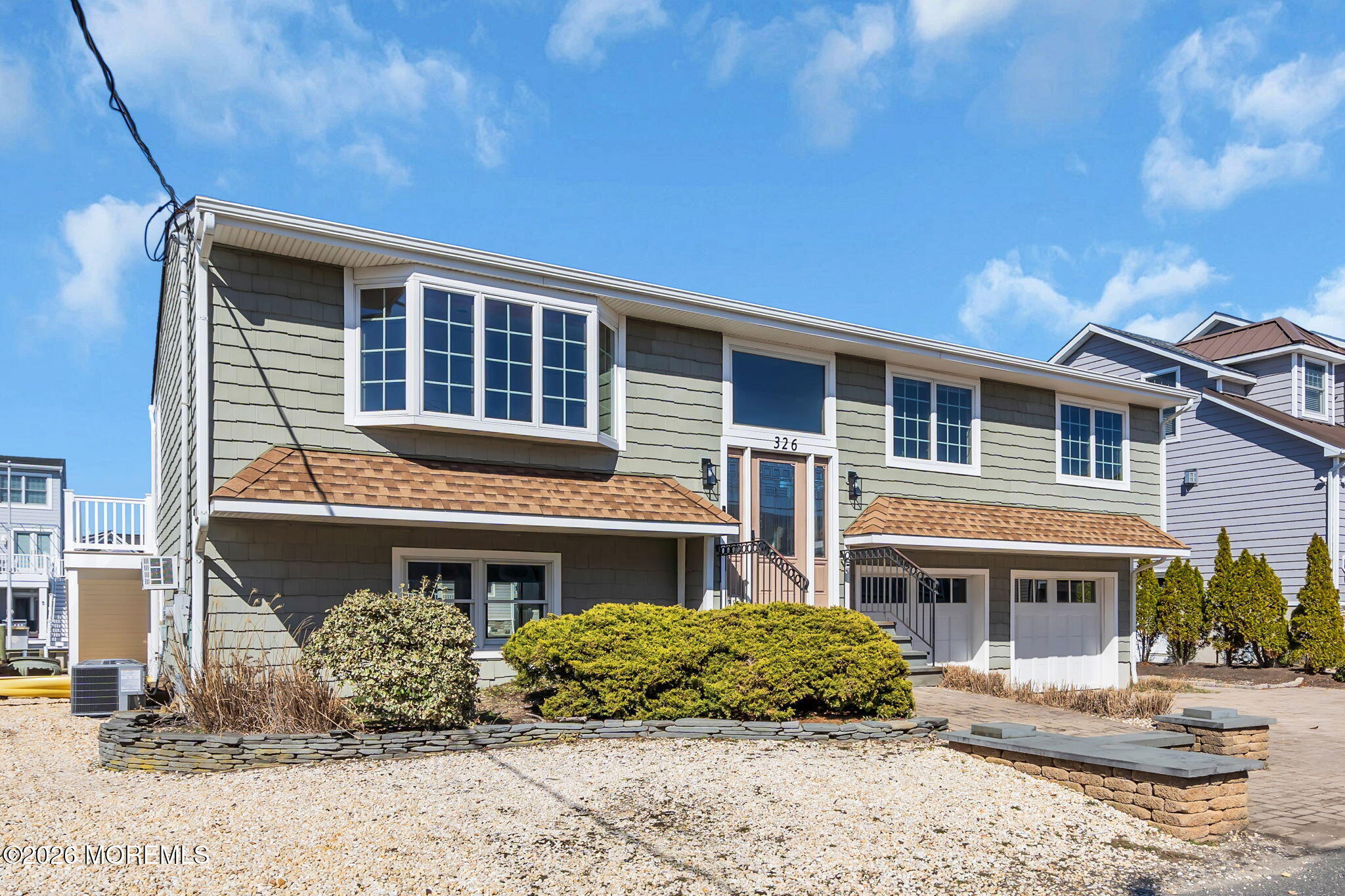 326 Cutter Lane Mantoloking, NJ 08738 - Photo 2 of 35 a front view of a house with a yard