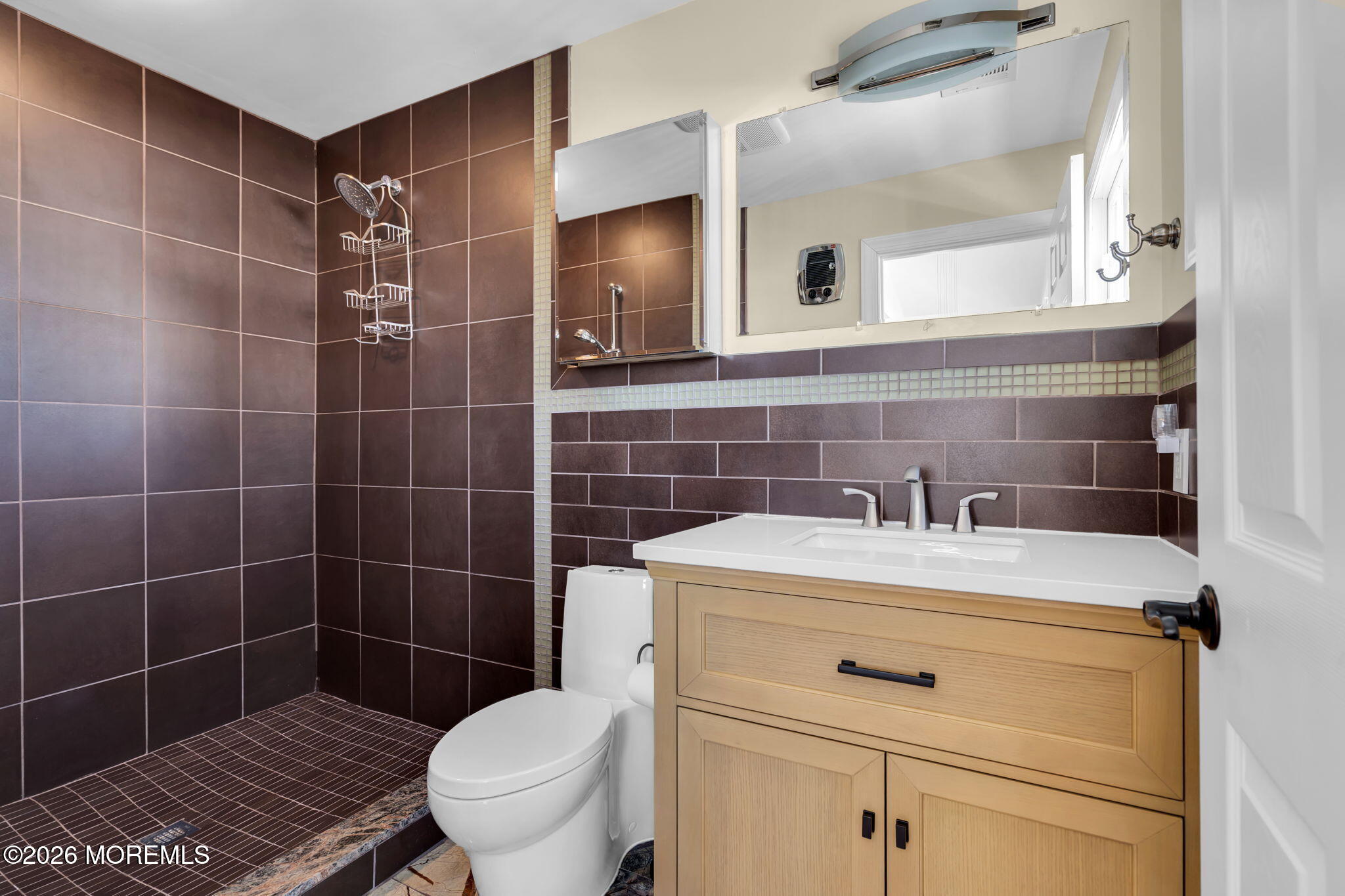 326 Cutter Lane Mantoloking, NJ 08738 - Photo 22 of 35 a bathroom with a sink toilet and mirror
