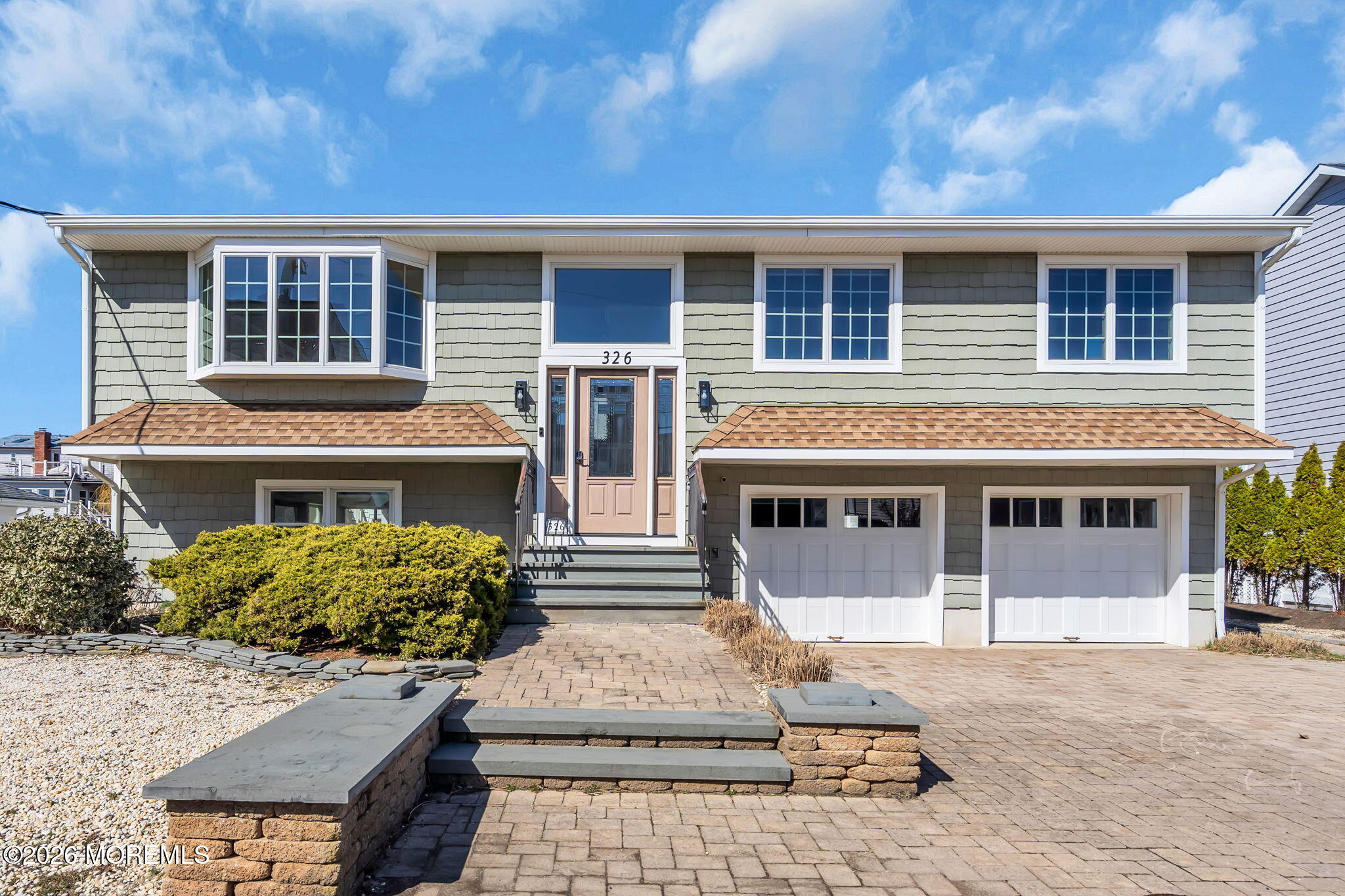 326 Cutter Lane Mantoloking, NJ 08738 - Photo 35 of 35 a front view of a house with a garden