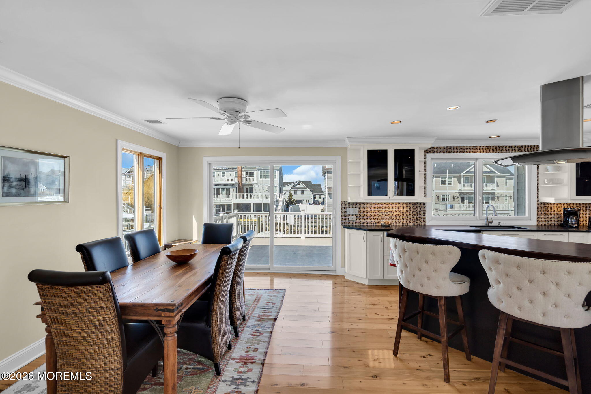 326 Cutter Lane Mantoloking, NJ 08738 - Photo 6 of 35 a dining room with furniture a window and wooden floor