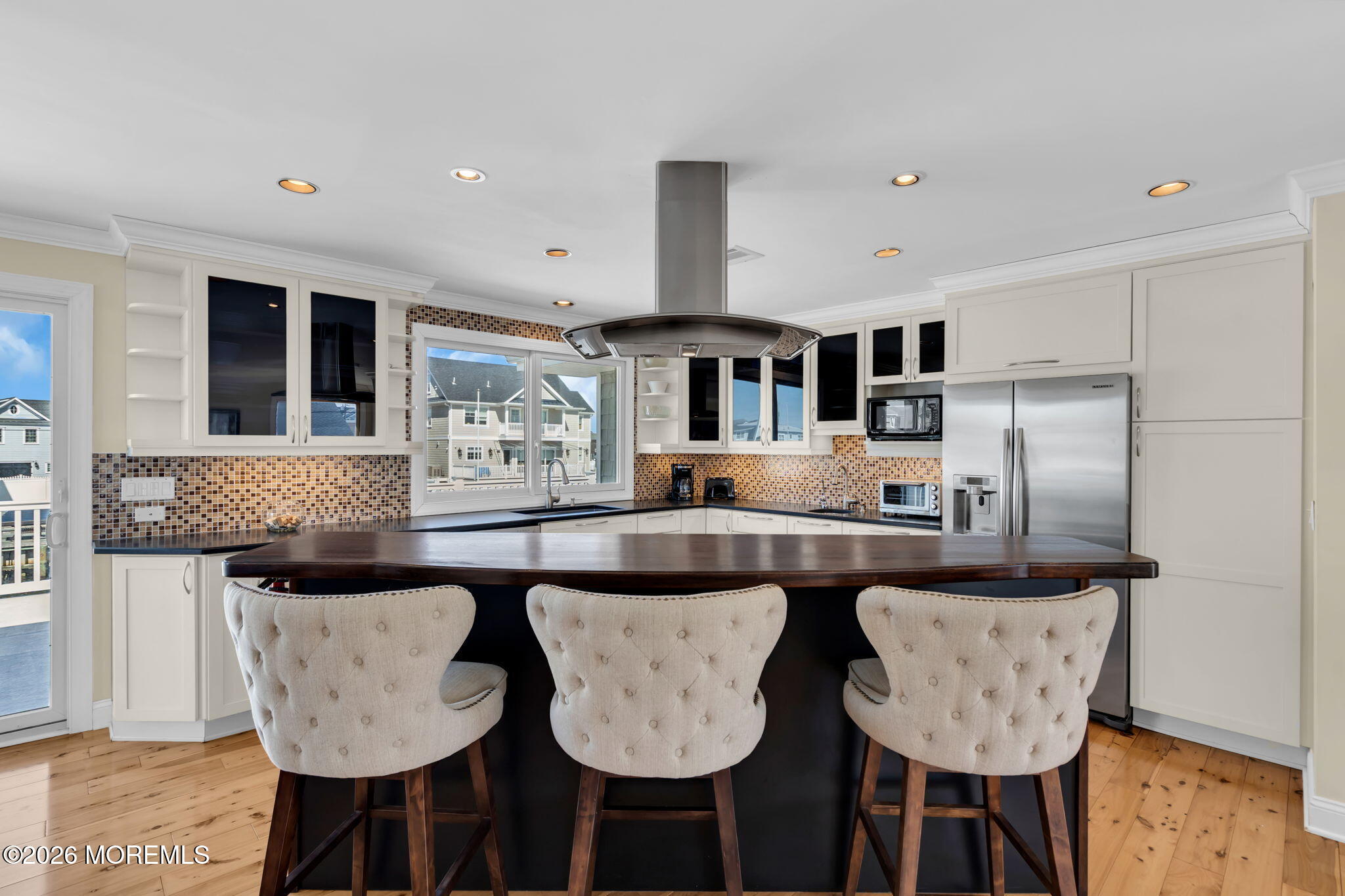326 Cutter Lane Mantoloking, NJ 08738 - Photo 7 of 35 a kitchen with stainless steel appliances granite countertop a table chairs and granite counter tops