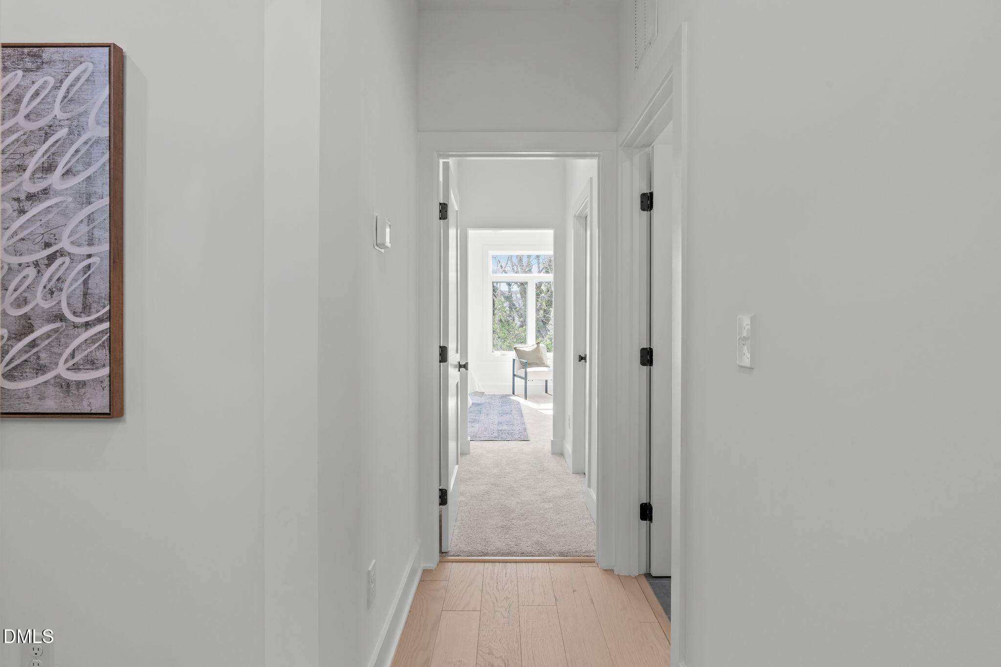 616 Rocky Knob Court Raleigh, NC 27601 - Photo 16 of 48 a view of a hallway with wooden floor and a bathroom