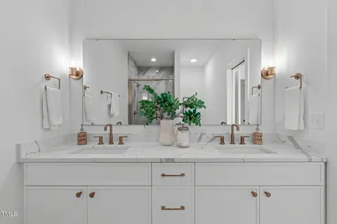 a bathroom with sink and mirror