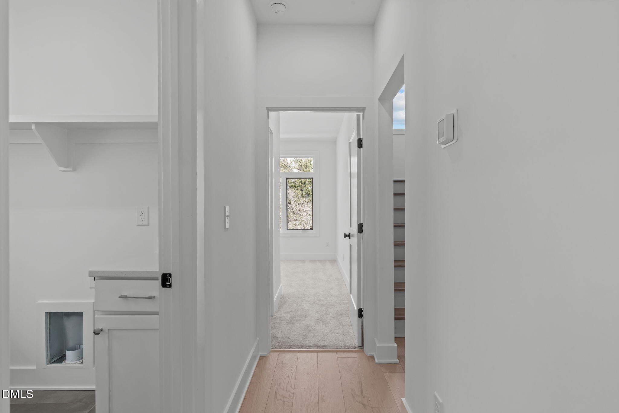 616 Rocky Knob Court Raleigh, NC 27601 - Photo 24 of 48 a view of a hallway with wooden floor