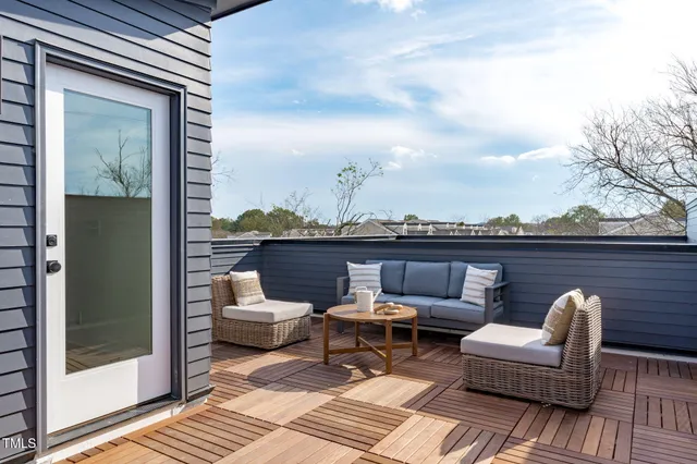 a view of a balcony with furniture