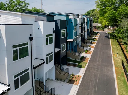 a view of balcony with wooden floor and seating space
