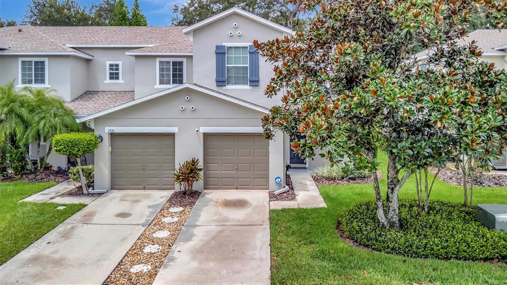 2928 Royal Tuscan Lane Valrico, FL 33594 - Photo 1 of 62 front view of a house with a yard