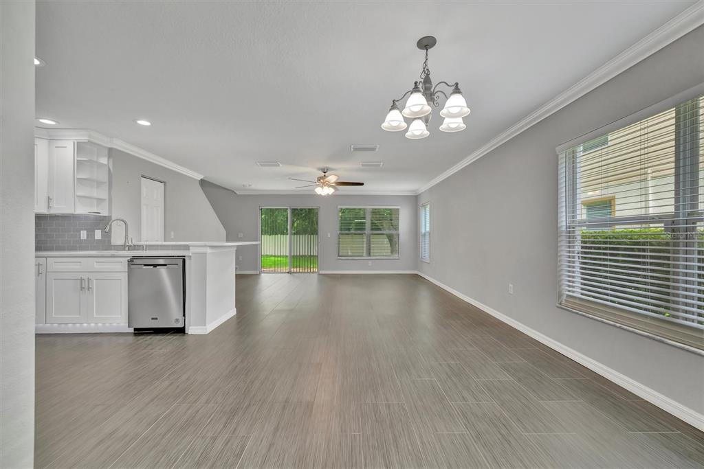 2928 Royal Tuscan Lane Valrico, FL 33594 - Photo 14 of 62 a view of a kitchen with wooden floor and a kitchen space