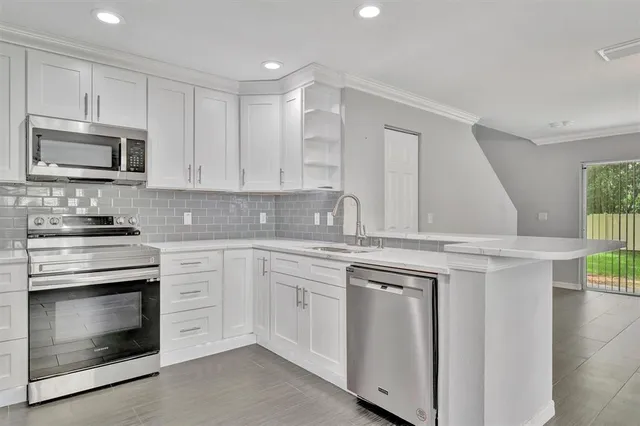 a kitchen with a sink and a window