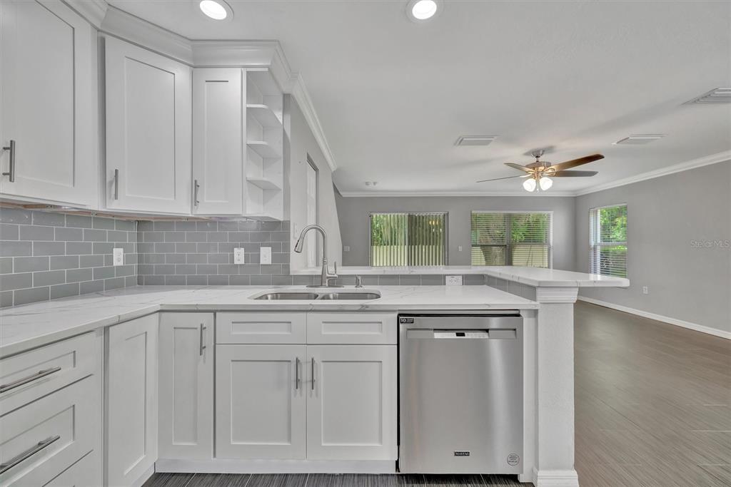 2928 Royal Tuscan Lane Valrico, FL 33594 - Photo 20 of 62 a kitchen with cabinets appliances and a counter space
