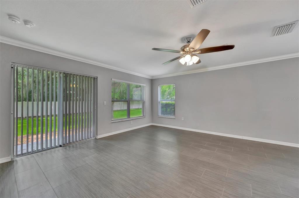 2928 Royal Tuscan Lane Valrico, FL 33594 - Photo 27 of 62 a view of an empty room with a window