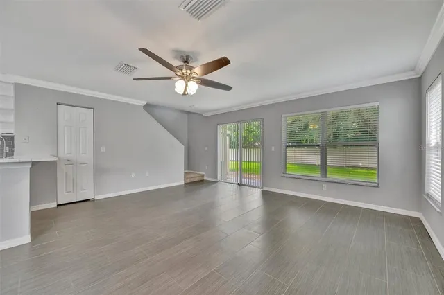 a view of an empty room with a window