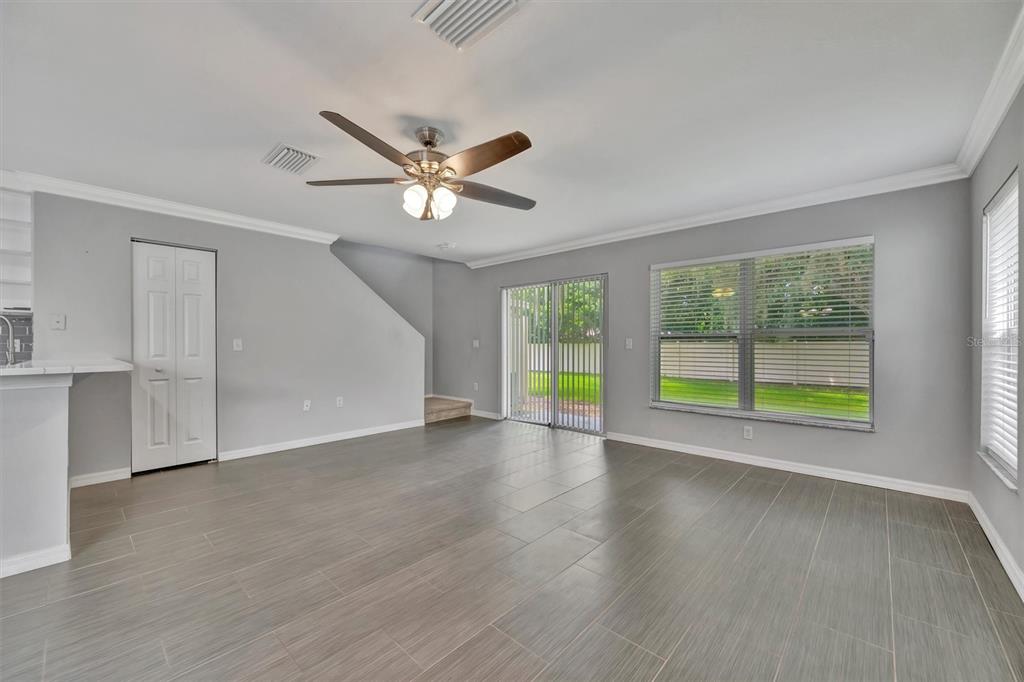 2928 Royal Tuscan Lane Valrico, FL 33594 - Photo 28 of 62 a view of an empty room with a window and wooden floor