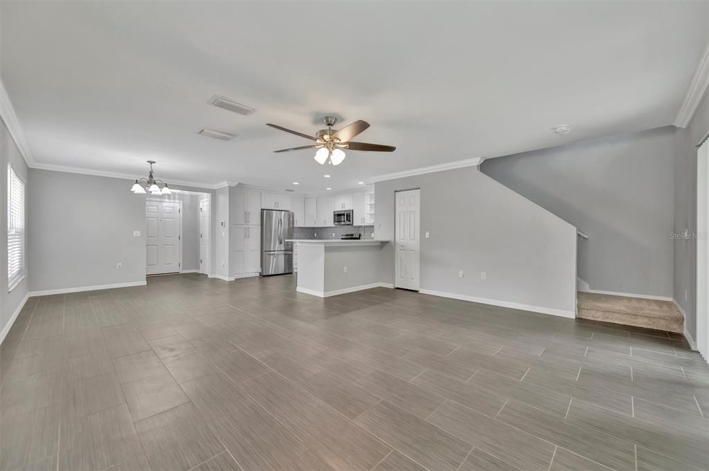 2928 Royal Tuscan Lane Valrico, FL 33594 - Photo 30 of 62 a view of a kitchen with a sink and a refrigerator