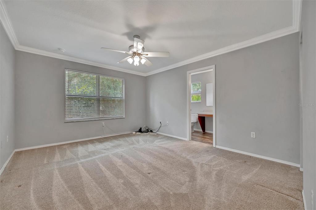 2928 Royal Tuscan Lane Valrico, FL 33594 - Photo 34 of 62 a view of an empty room with a window