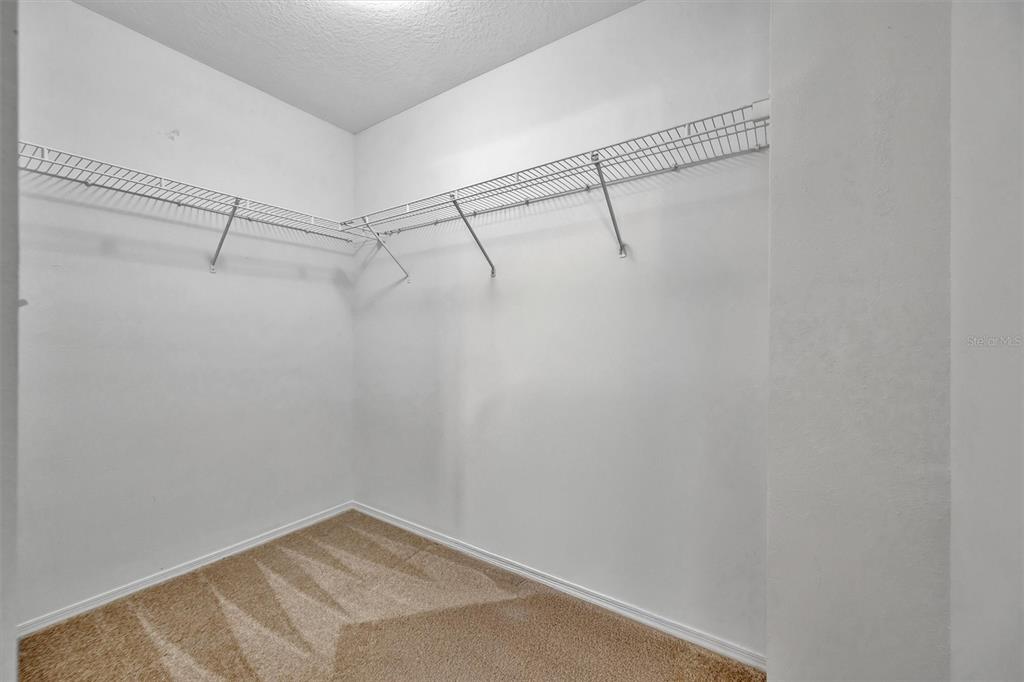 2928 Royal Tuscan Lane Valrico, FL 33594 - Photo 35 of 62 a view of a room with racks on the wall