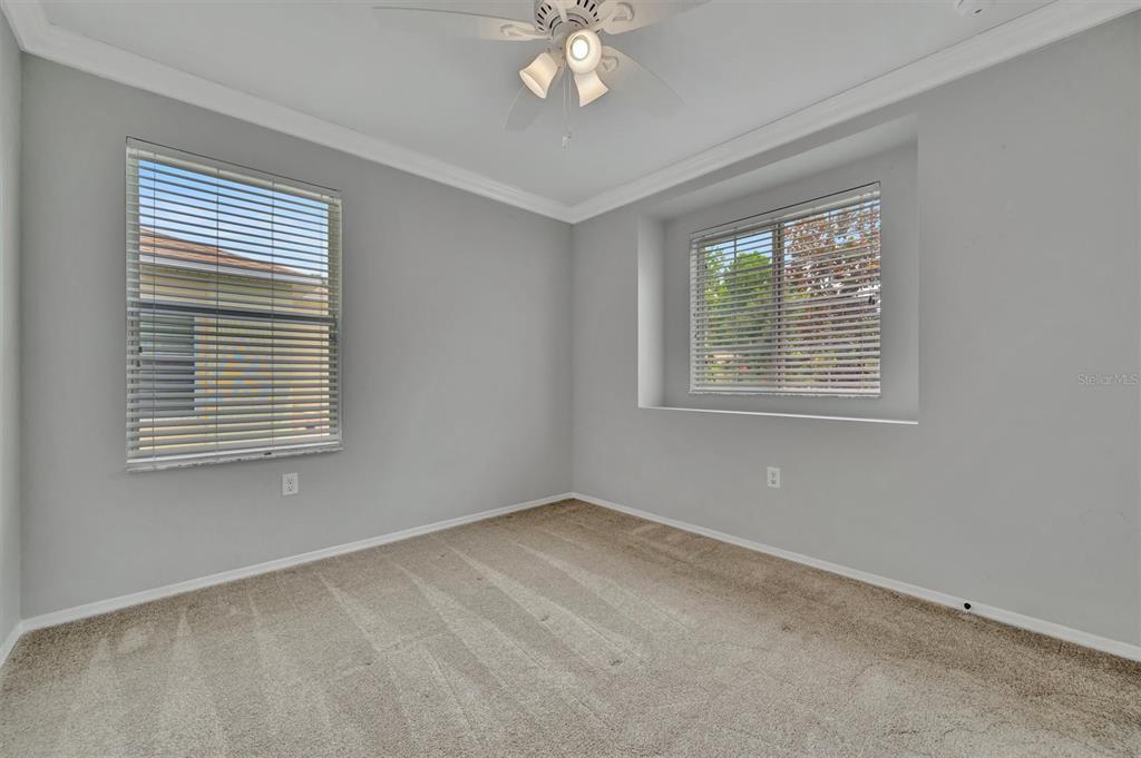 2928 Royal Tuscan Lane Valrico, FL 33594 - Photo 41 of 62 a view of an empty room with a window