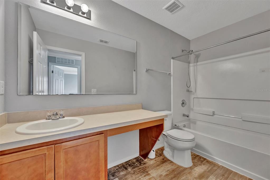 2928 Royal Tuscan Lane Valrico, FL 33594 - Photo 42 of 62 a bathroom with a sink toilet and shower
