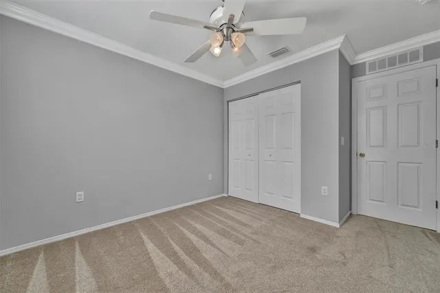 a view of a house with a yard and tree