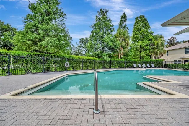 a sign that is sitting in front of flowers