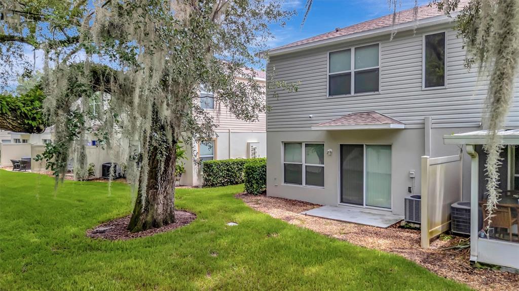 2928 Royal Tuscan Lane Valrico, FL 33594 - Photo 54 of 62 a view of a house with a yard and tree