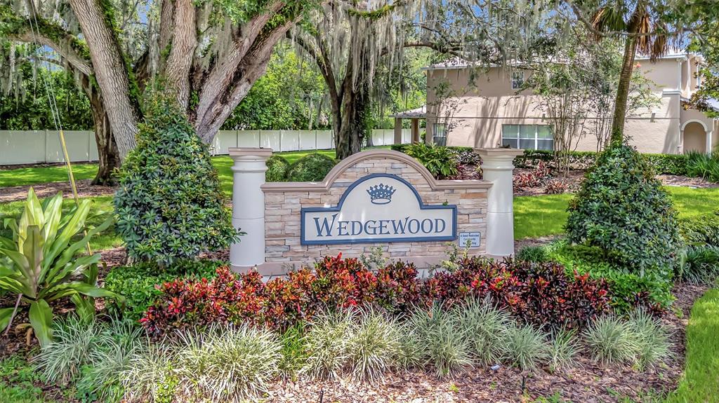 2928 Royal Tuscan Lane Valrico, FL 33594 - Photo 60 of 62 a sign that is sitting in front of flowers