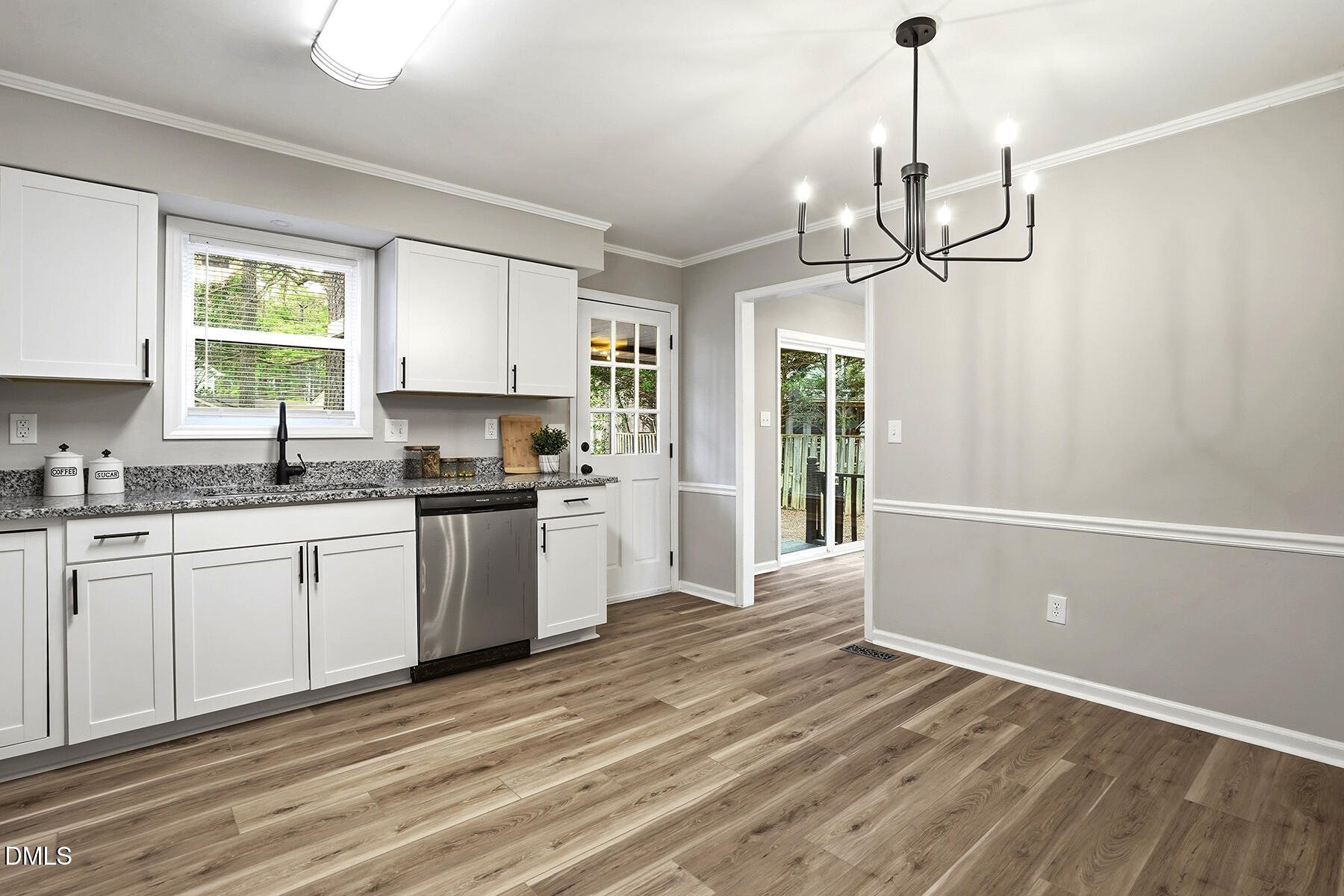 812 Chalk Level Road Durham, NC 27704 - Photo 10 of 31 a kitchen with granite countertop a stove a sink and white cabinets