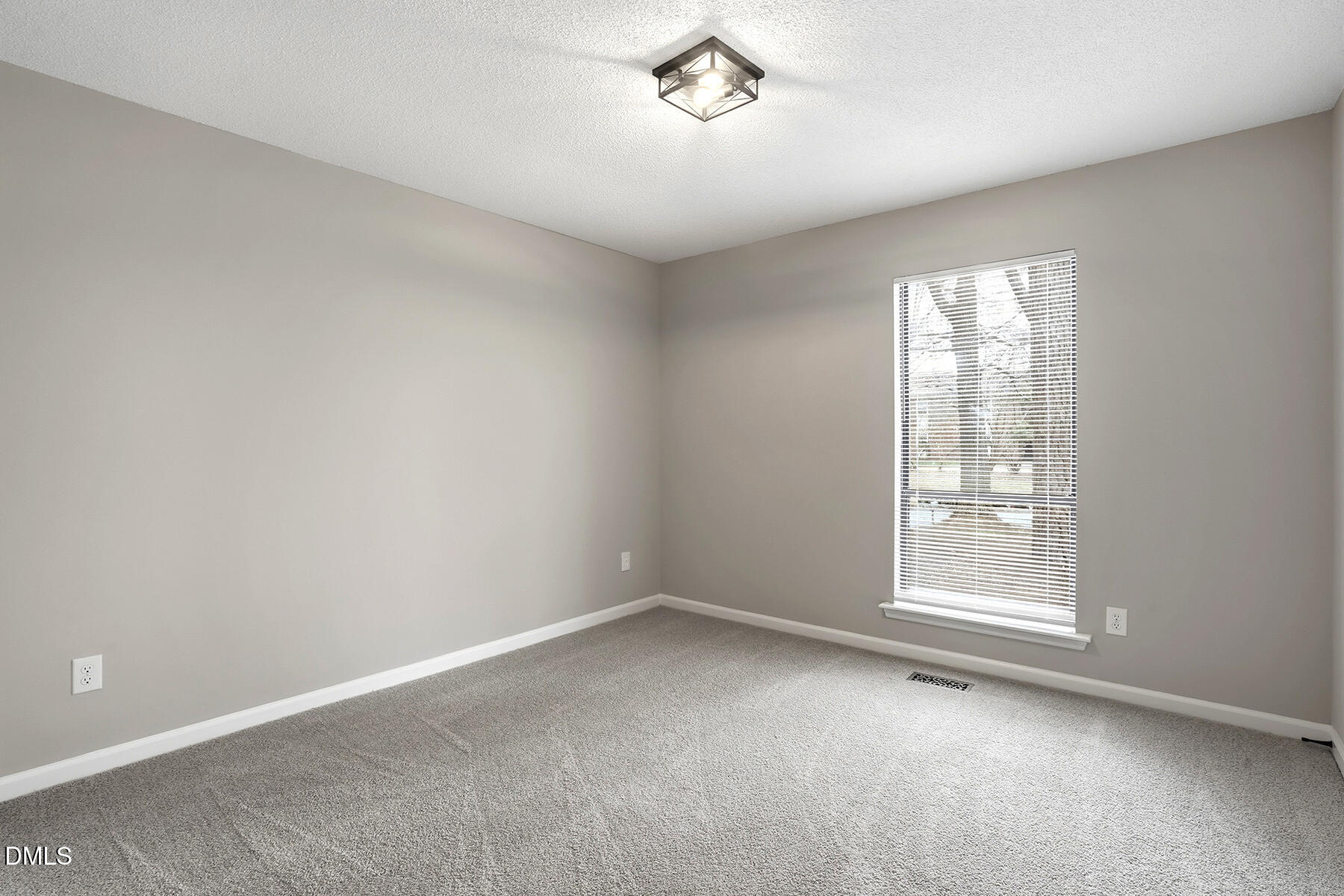812 Chalk Level Road Durham, NC 27704 - Photo 13 of 31 an empty room with a window