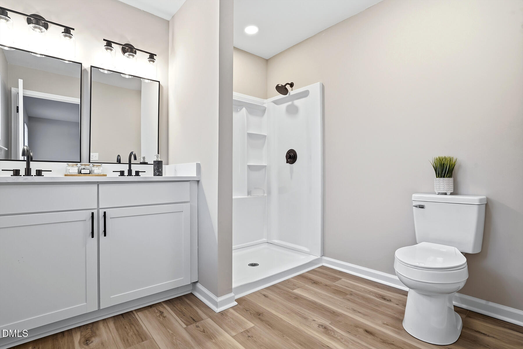 812 Chalk Level Road Durham, NC 27704 - Photo 23 of 31 a bathroom with a sink a toilet and shower