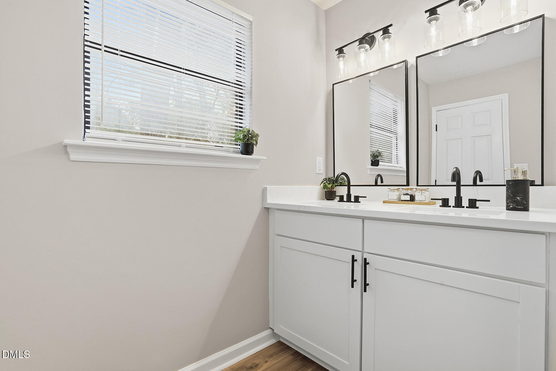 812 Chalk Level Road Durham, NC 27704 - Photo 24 of 31 a bathroom with a sink and a mirror