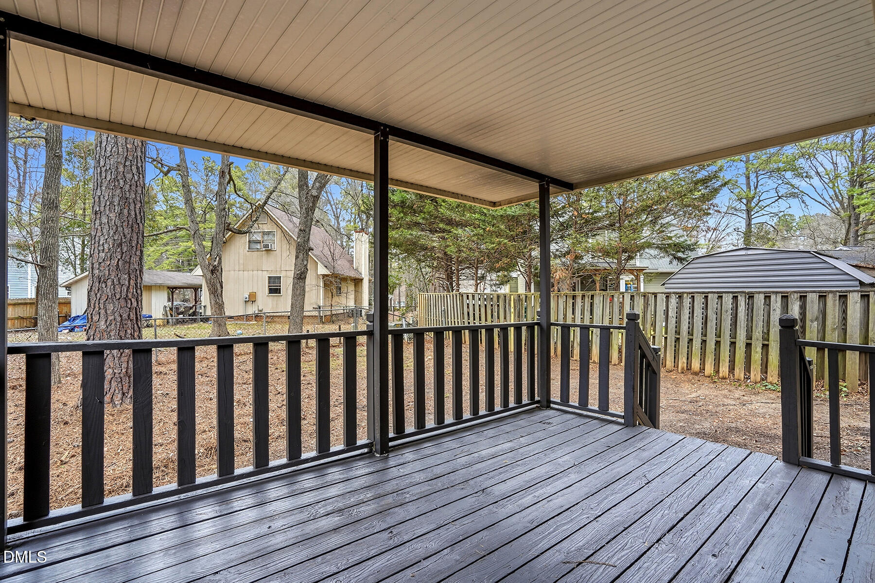 812 Chalk Level Road Durham, NC 27704 - Photo 26 of 31 a view of a wooden deck with a yard