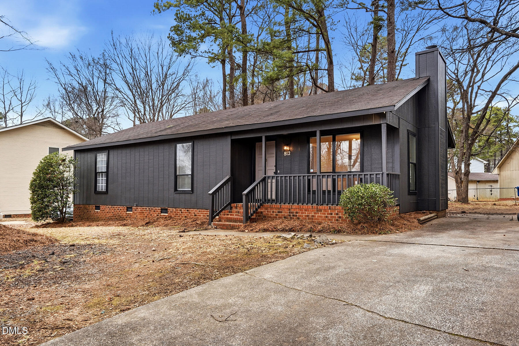812 Chalk Level Road Durham, NC 27704 - Photo 2 of 31 a front view of a house with a dirt yard and a large tree
