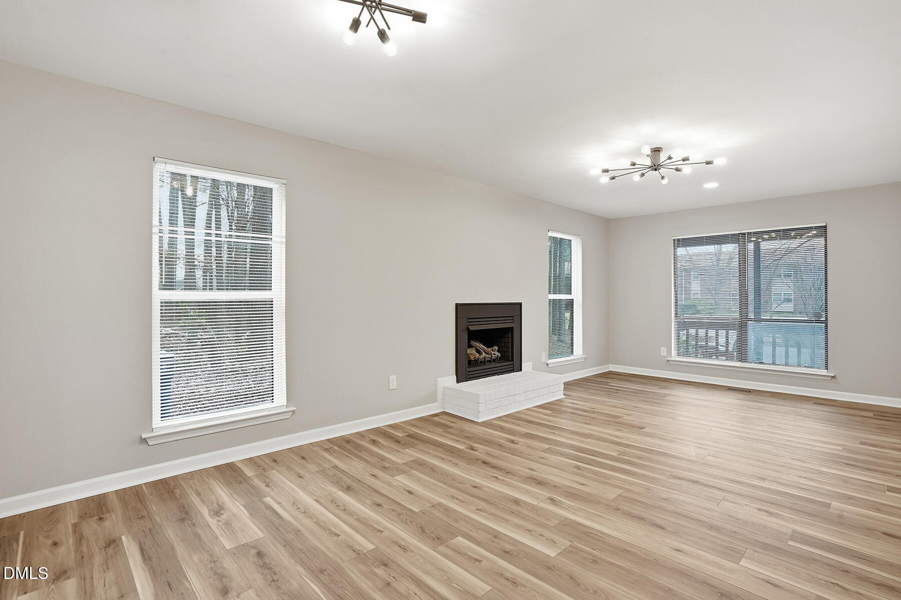 812 Chalk Level Road Durham, NC 27704 - Photo 7 of 31 a view of an empty room with a window and fireplace